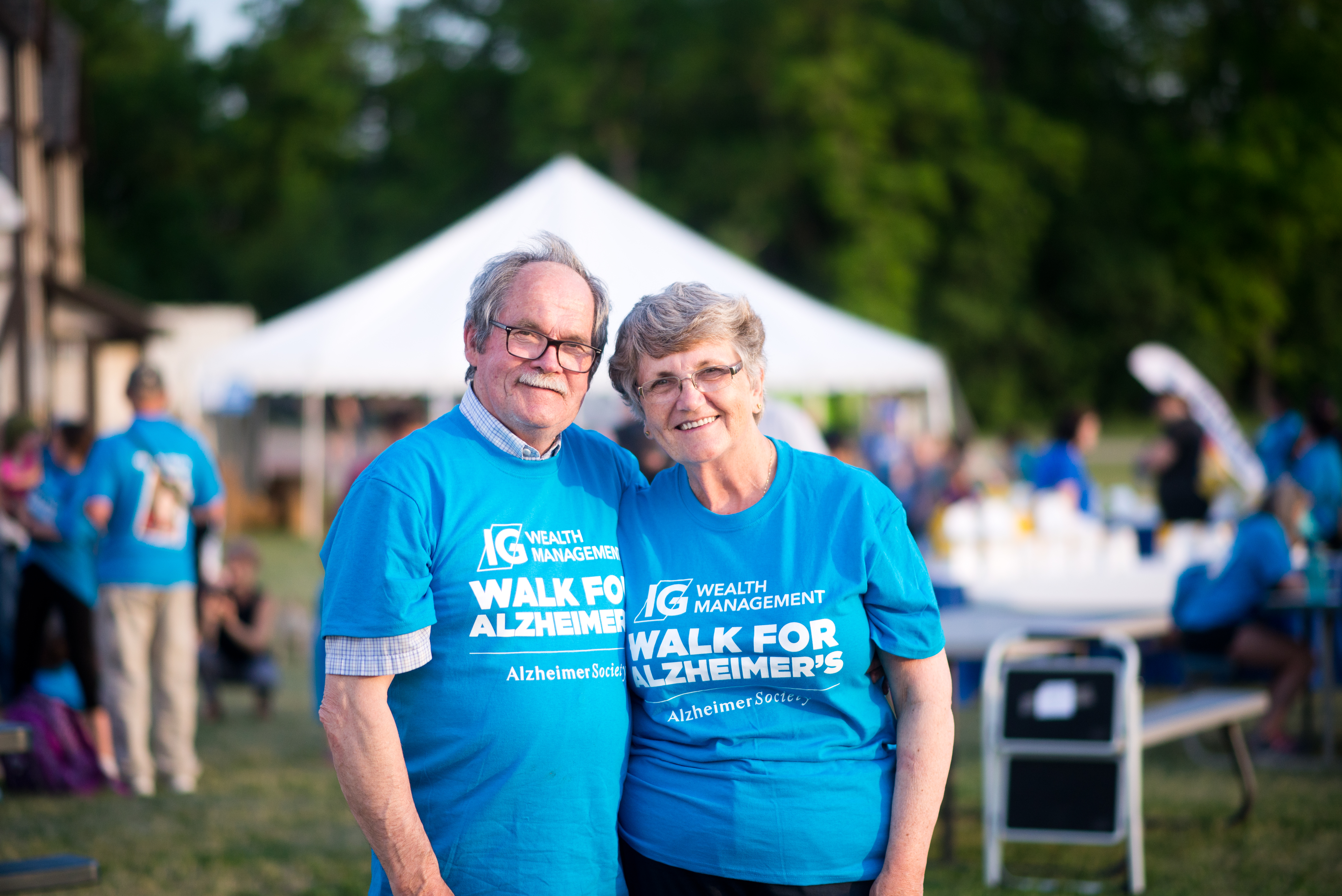 Senior Man and Woman Smiling - Light Blue IG Shirt