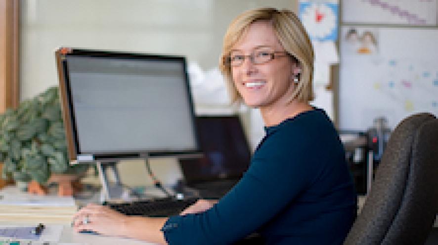 smiling-woman-working-at-desk_2.jpg