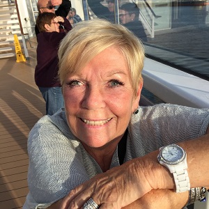 Cheryl smiling at the pier.