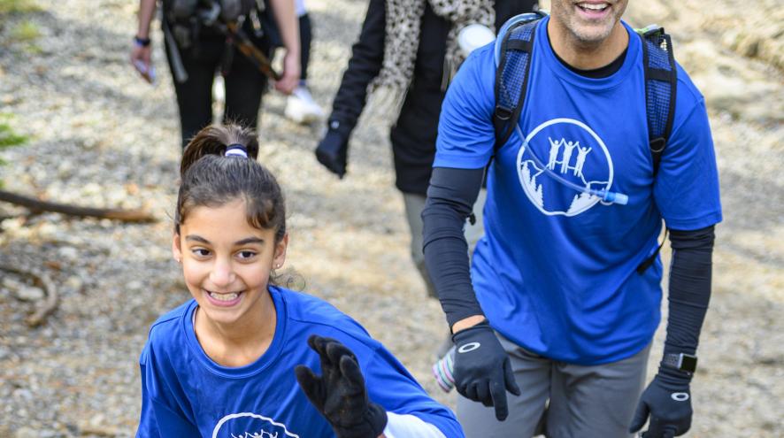 Talia smiling as she climbs Grouse Mountain in the 2019 Climb for Alzheimer's.