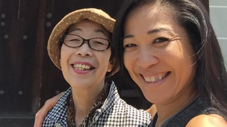 Masami and Masako smiling together.