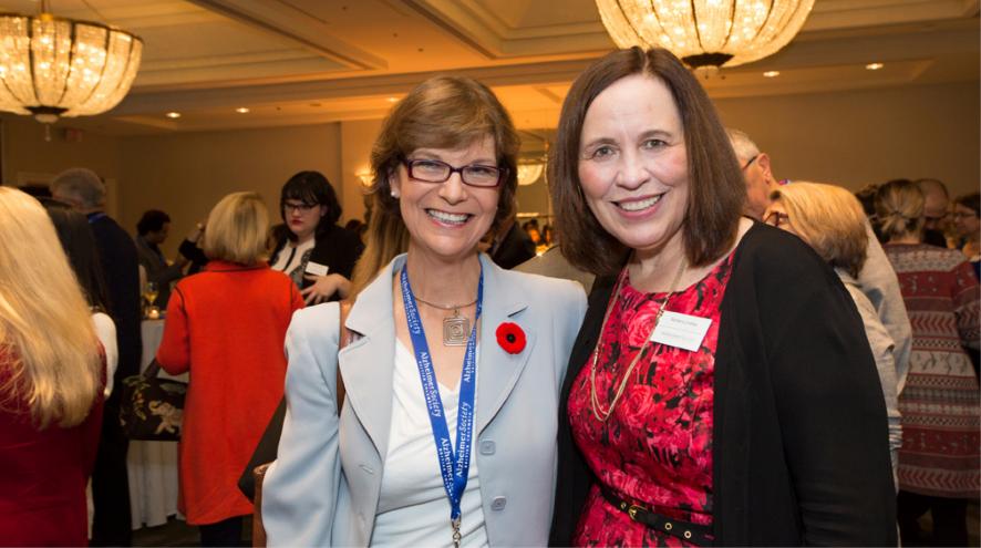 Barbara smiling and posing at a Society event.