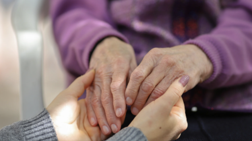 Two people holding hands