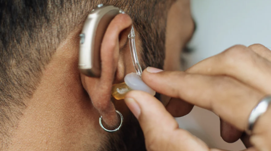 Man trying on hearing aids