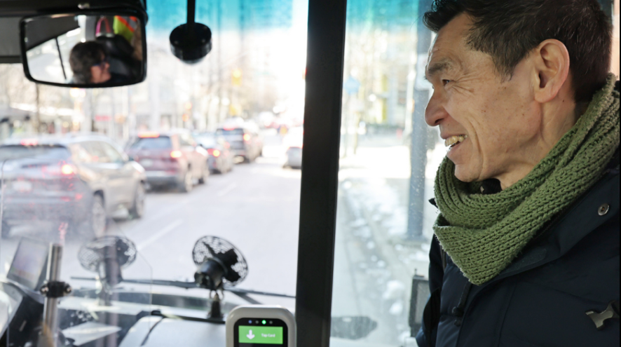 A man boarding a bus
