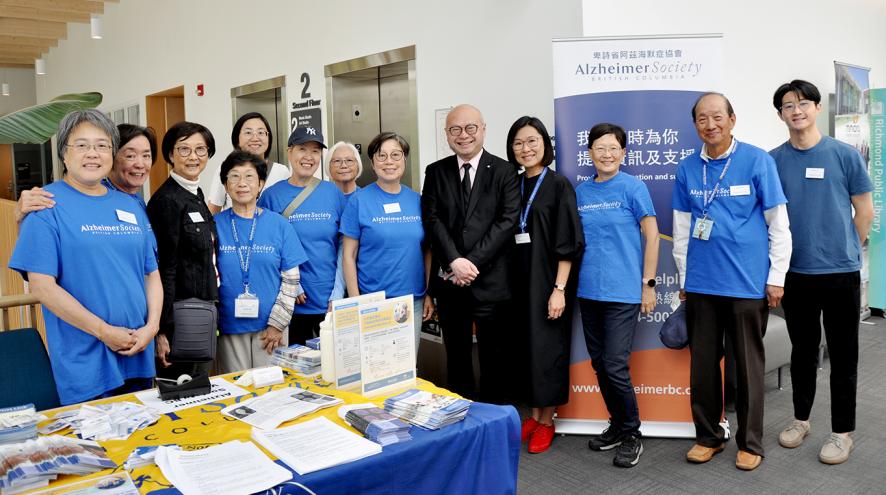 Group of volunteers staff and Dr. Wong in a workshop
