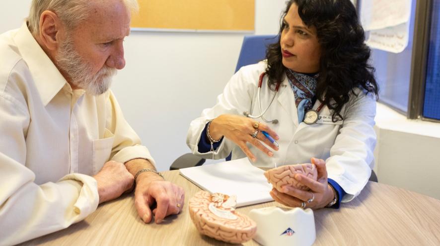 A health-care provider and client discuss treatment options.