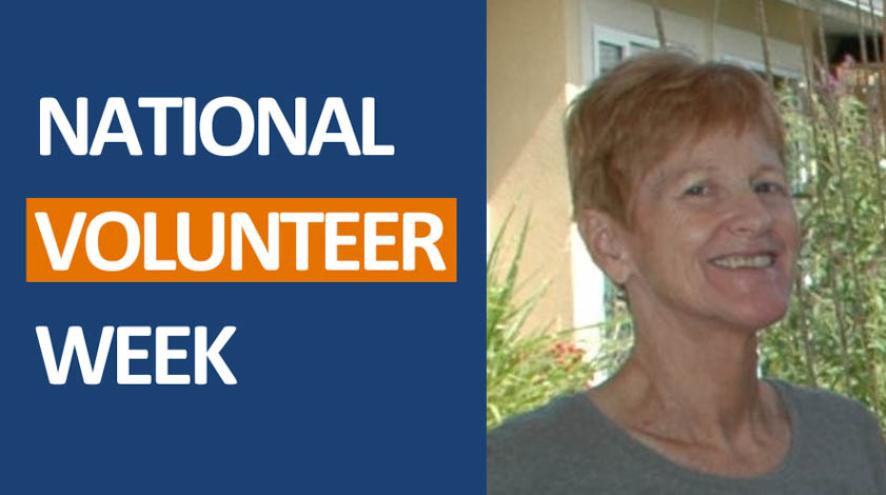 National Volunteer Week promotion with a woman standing outside in front of trees smiling