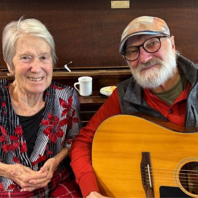 Janet pictured next to her husband, Terry, who is holding a guitar.