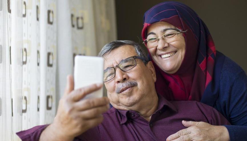 Senior-couple-looking-at-phone-together.jpg