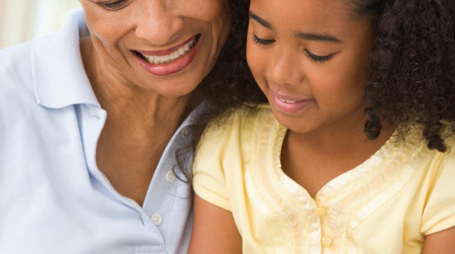 Young child and older woman smiling