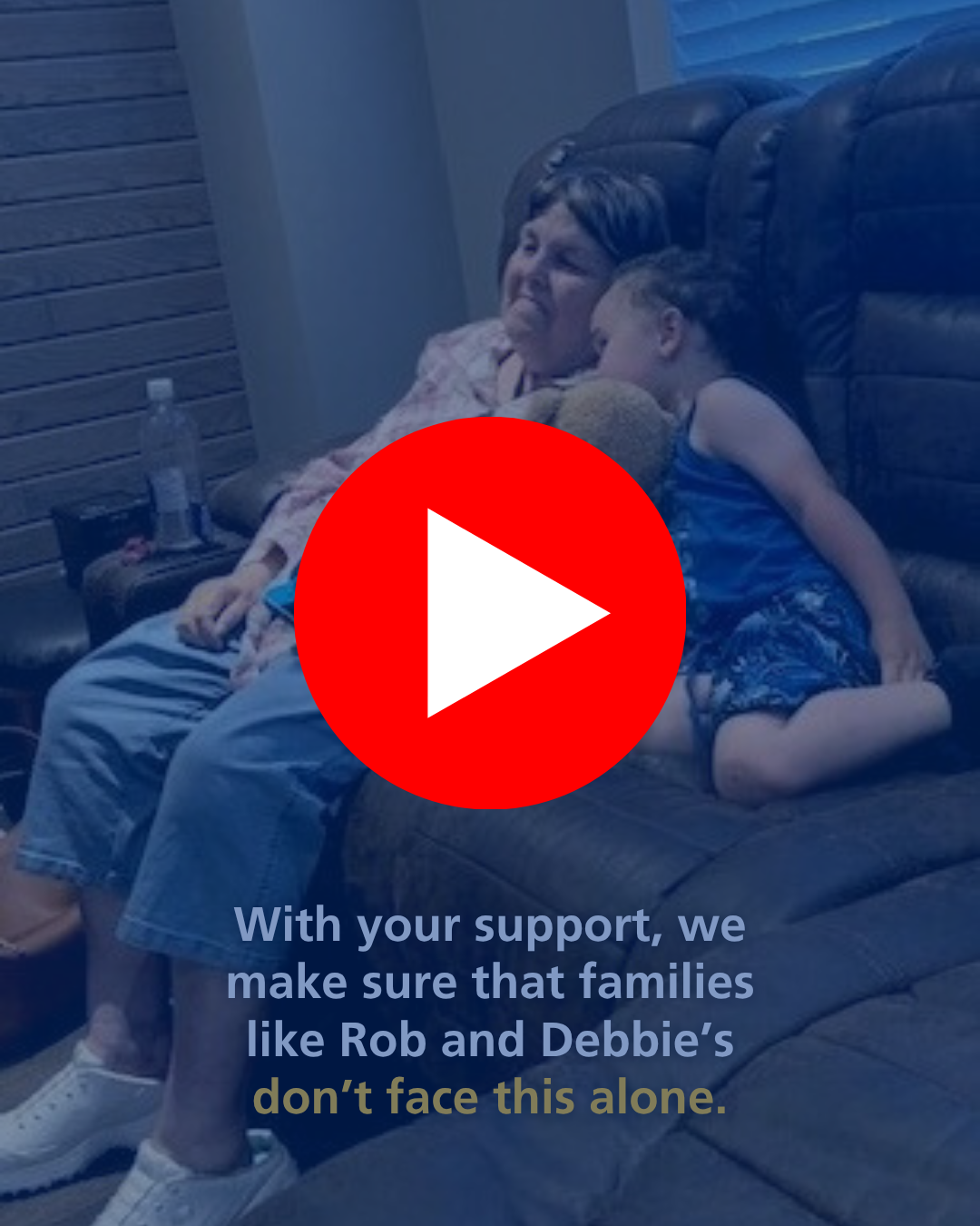 Photo of Debbie and grandchild sitting on the couch