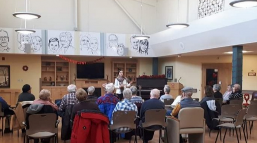 group of people enjoying a presentation