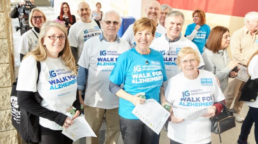 Group of people in IG Weath Management Walk for Alzheimer's t-shirts.