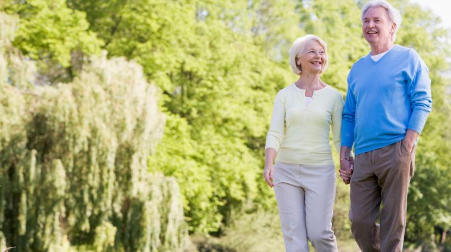 Older couple walking hand in hand