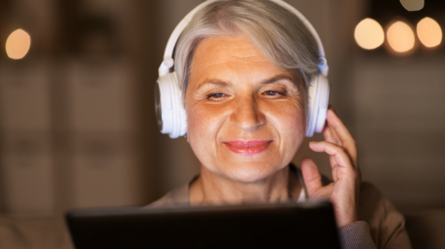 Older woman listening to headphones