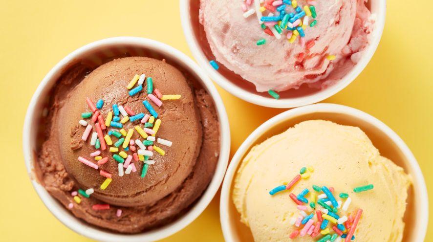three cups of ice cream with sprinkles