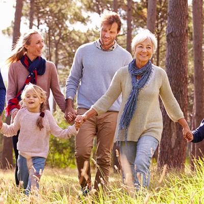 Family taking a hike through the woods.