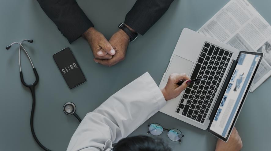 Doctor showing webpage to a patient