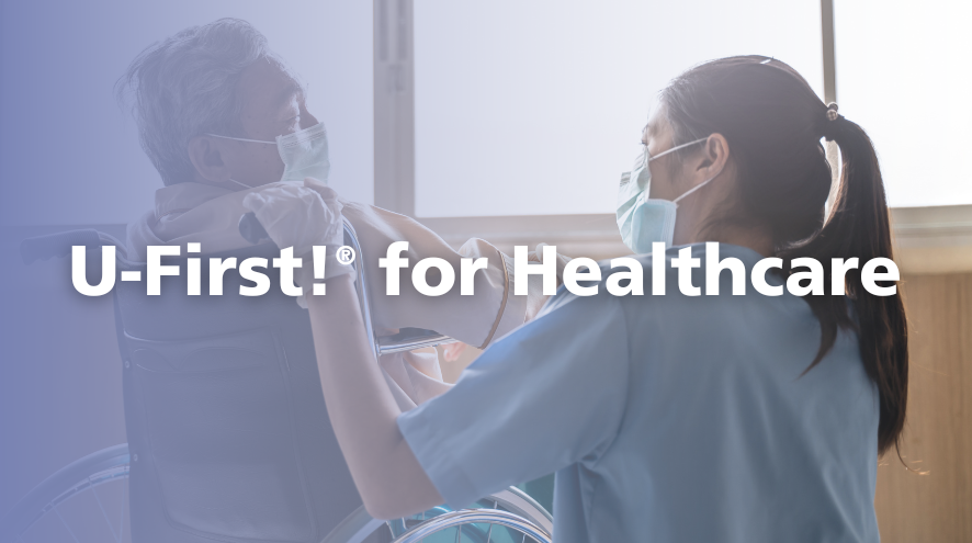 A nurse wearing a mask is leaning down to eye-level of an older person in a wheelchair who is also masked. The overset text reads "U-First for healthcare."