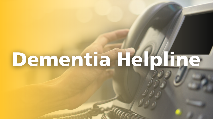 A hand reaches to pick up a landline phone with the text "Dementia Helpline" and a yellow gradient.