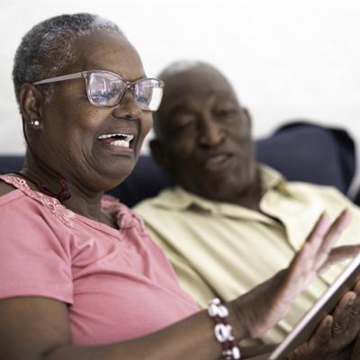 Couple looking at their tablet