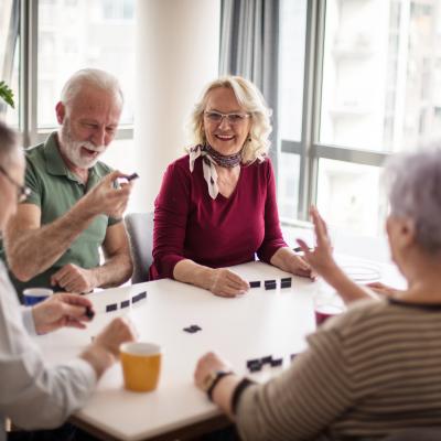 Photo of older adults playing games at a table