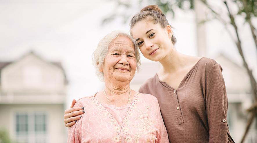 Granddaughter hugging her grandmother