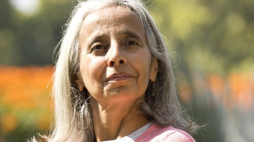 Senior woman standing in a park 