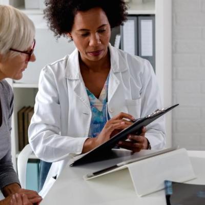 Two people looking at an ipad