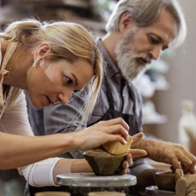 Two people making pottery