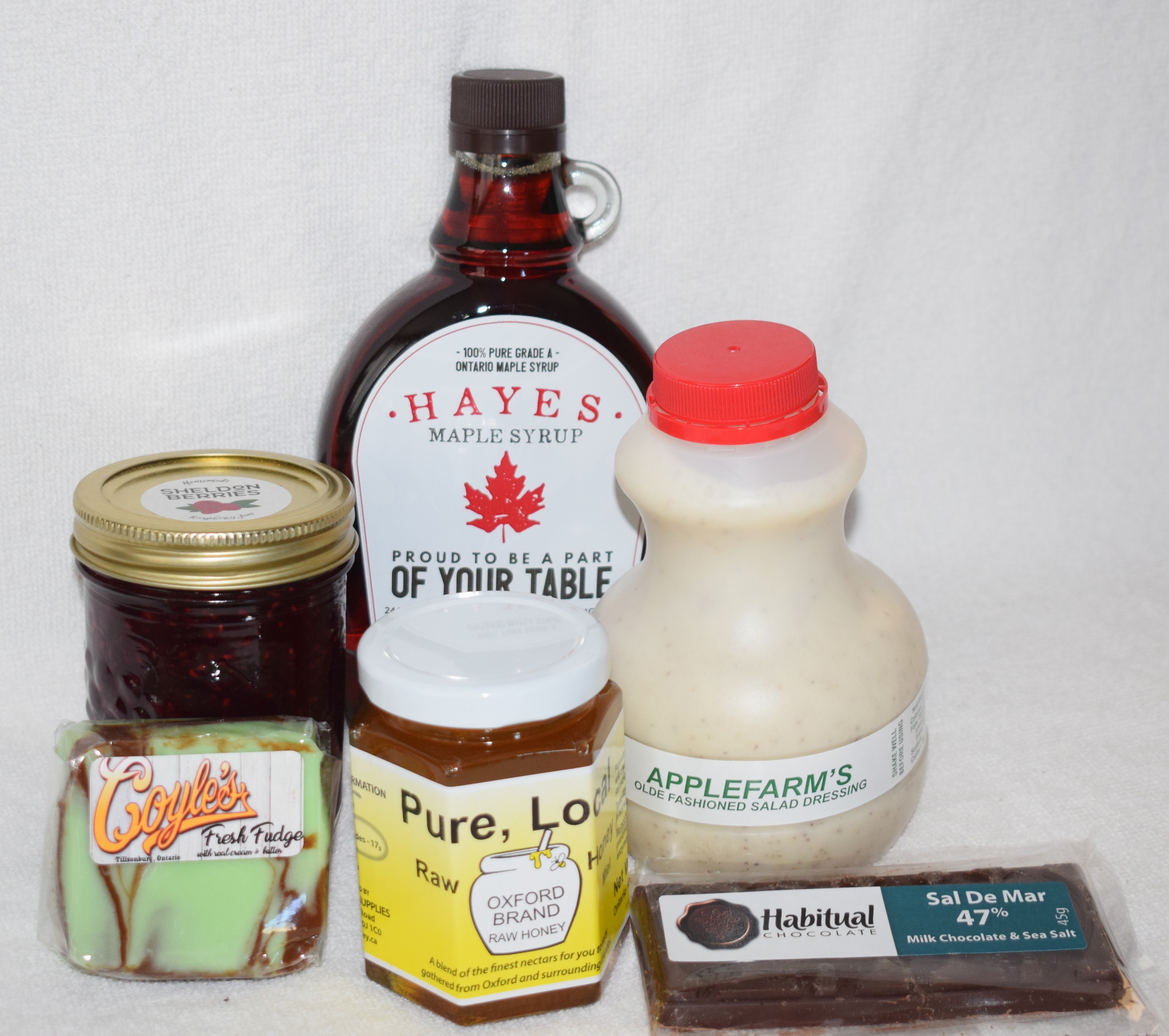 A picture of maple syrup, honey, chocolate, and more.