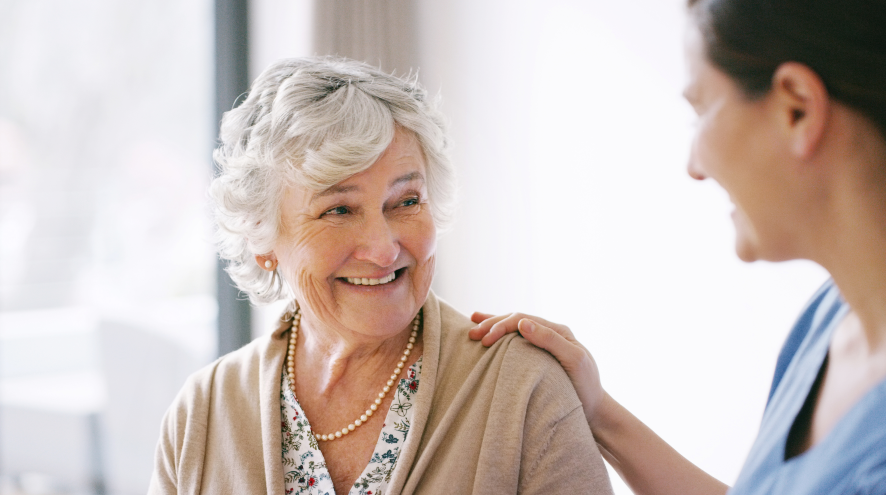 Senior woman smiling at doctor's office.