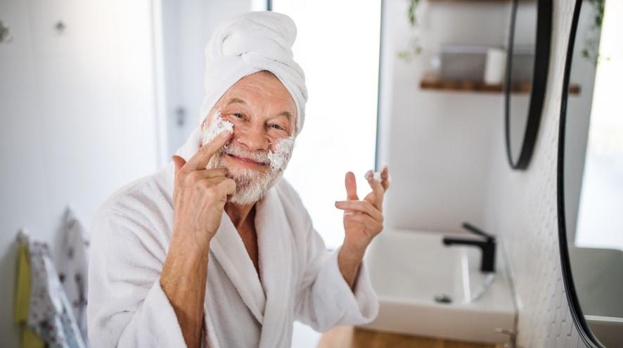 Senior man doing bathing routine.
