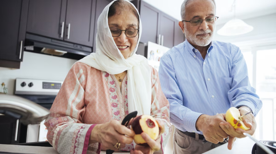 Older Couple peeling apples