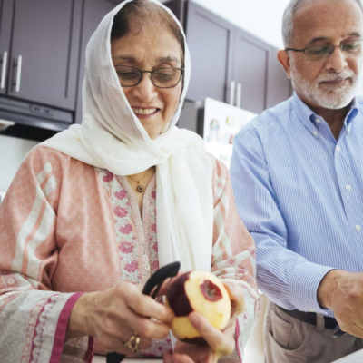 Older Couple peeling apples