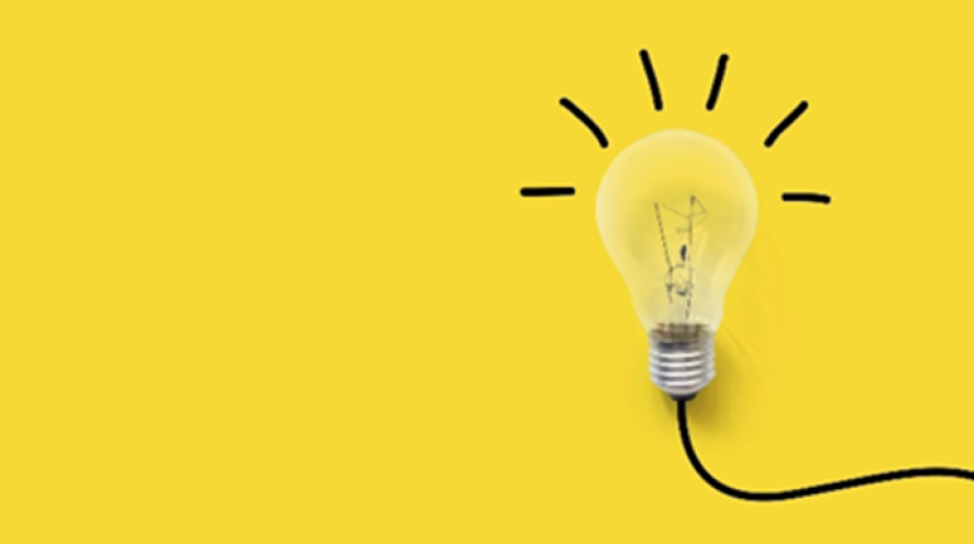 A picture of a light bulb on a yellow background