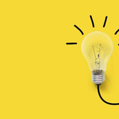 A picture of a light bulb on a yellow background