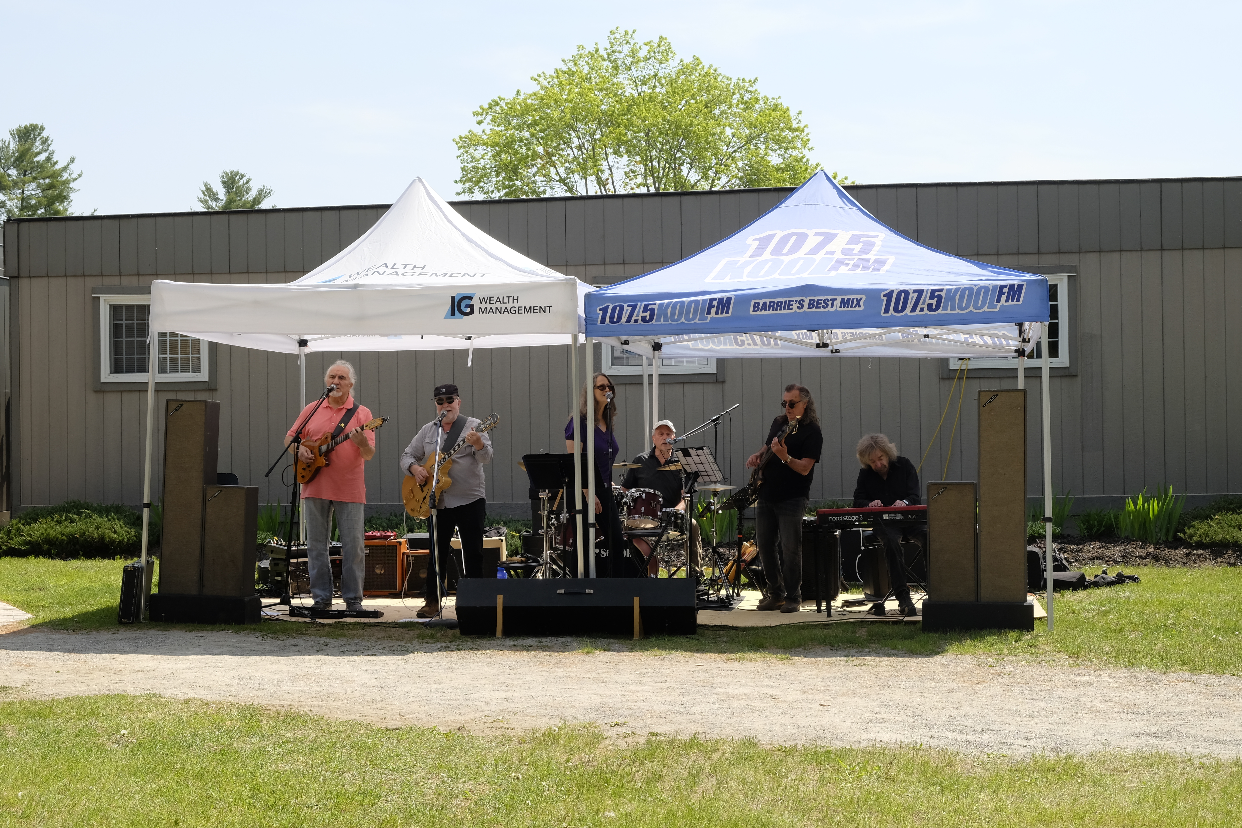 Two tents with a band