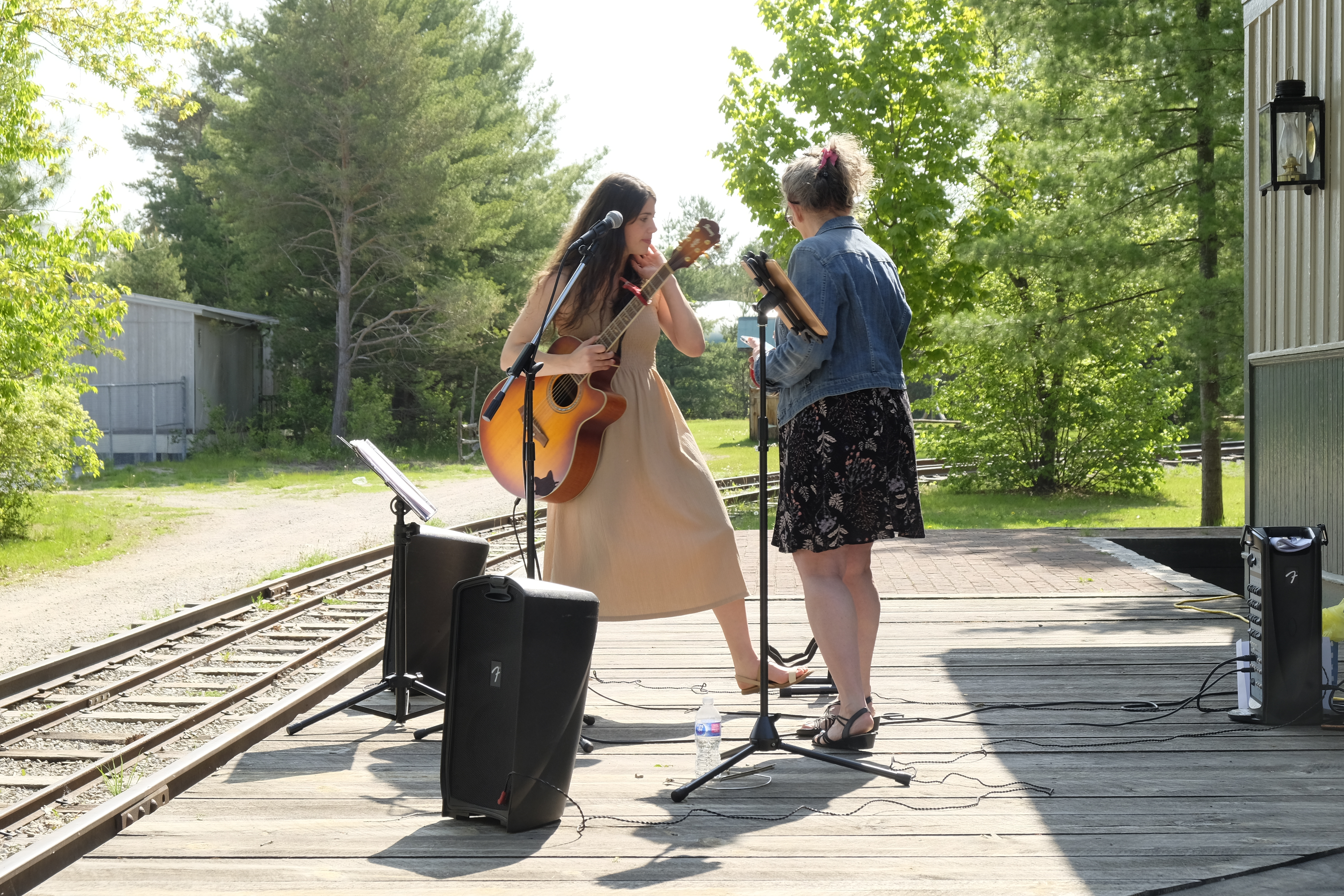 Two individuals playing guitar