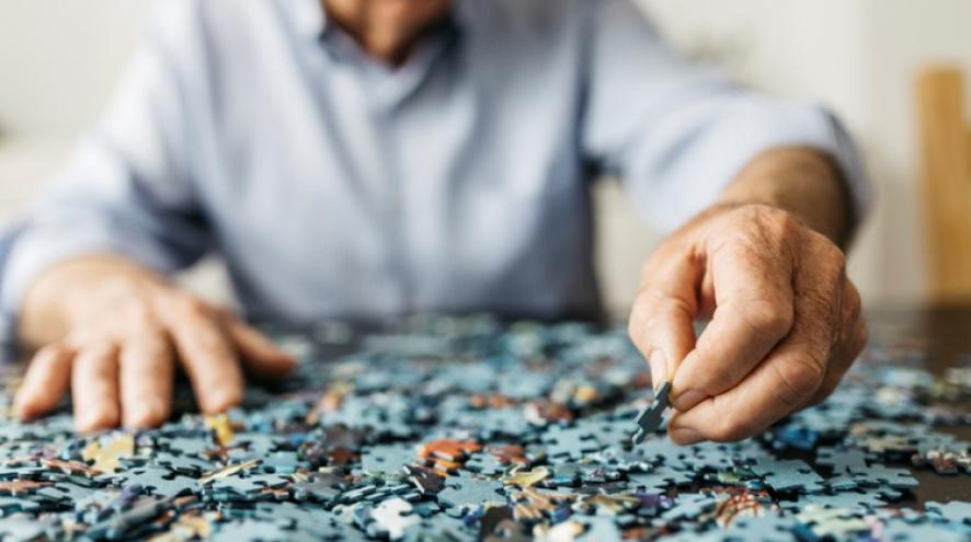 Older person completing a puzzle