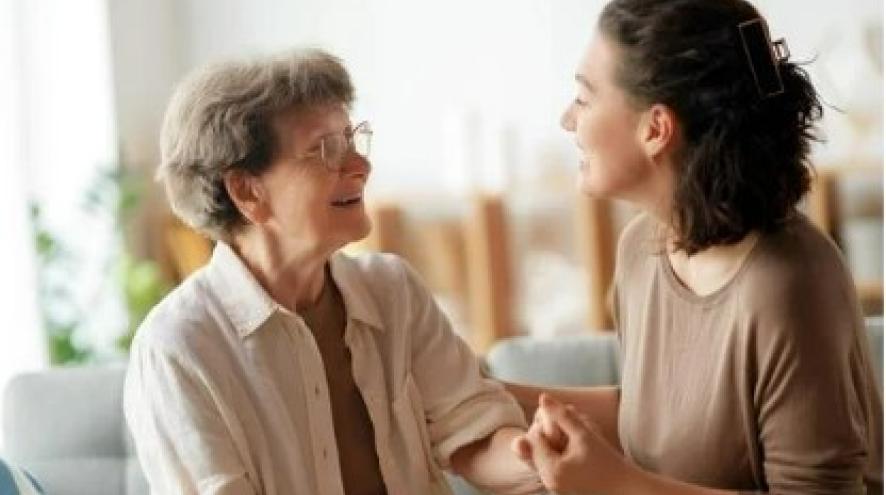 Caregiver holding hands