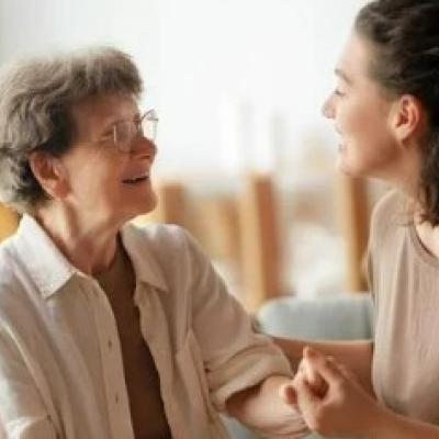 Caregiver holding hands