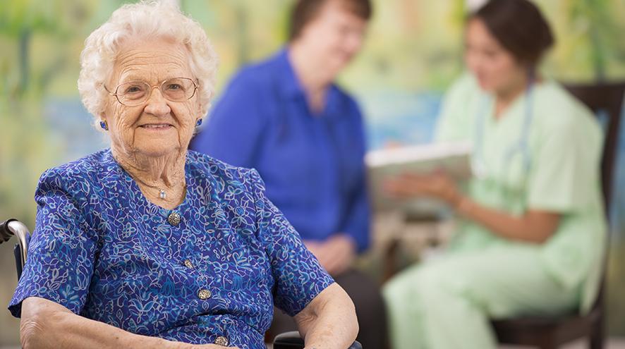 Smiling senior woman at care home.