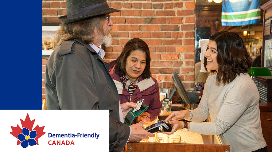 Two senior citizens having a pleasant conversation with a retail worker. The Dementia-Friendly Canada logo is visible in the lower left corner.