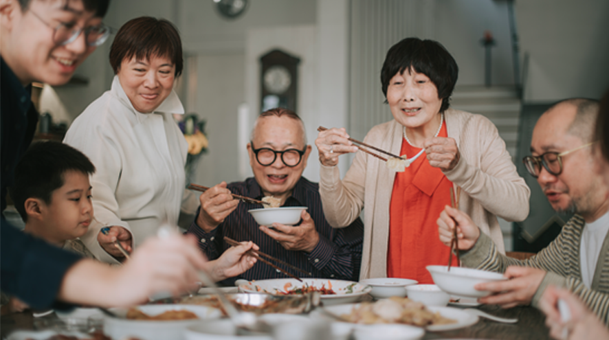 A multigenerational family eating a meal