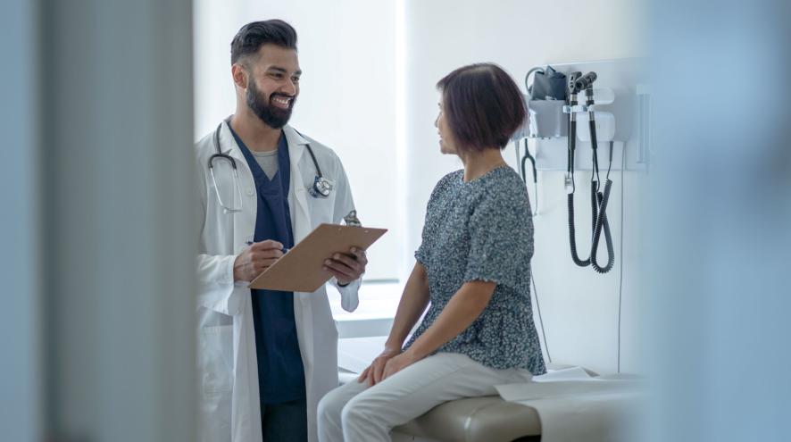 A doctor visiting with a patient