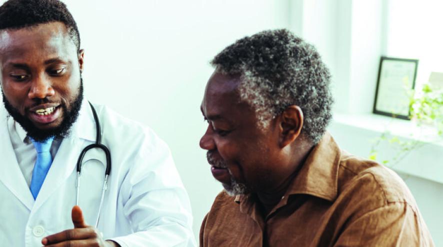 A medical professional consults with a patient