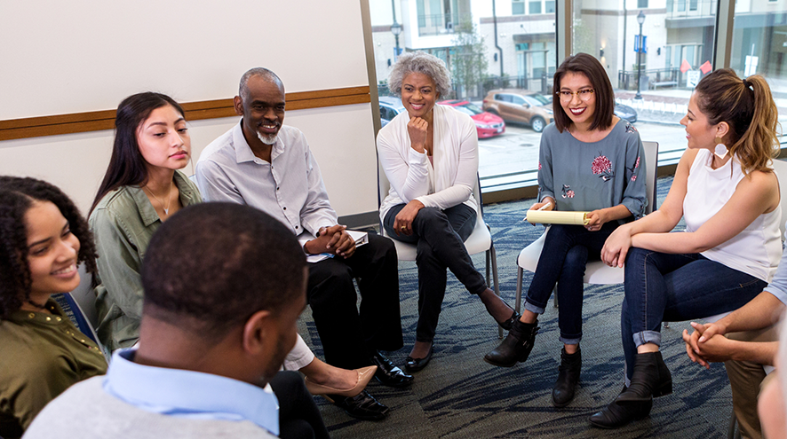 People sitting on chairs in a circle