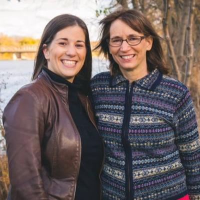 Cassandra and her mother, Karen, standing outside and smiling.